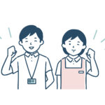 ガッツポーズをする介護職員